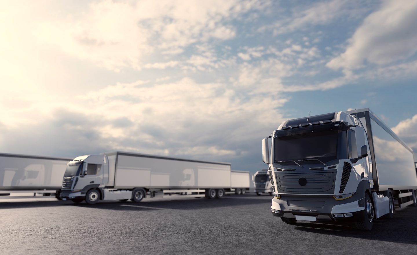 Heavy-duty trucks lined up in a fleet yard
